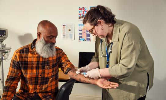 A man is having a blood test in his diabetes appointment