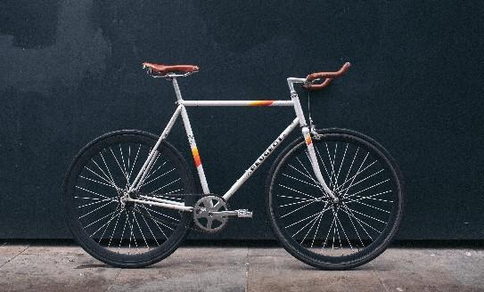 A bike leaning against a dark wall