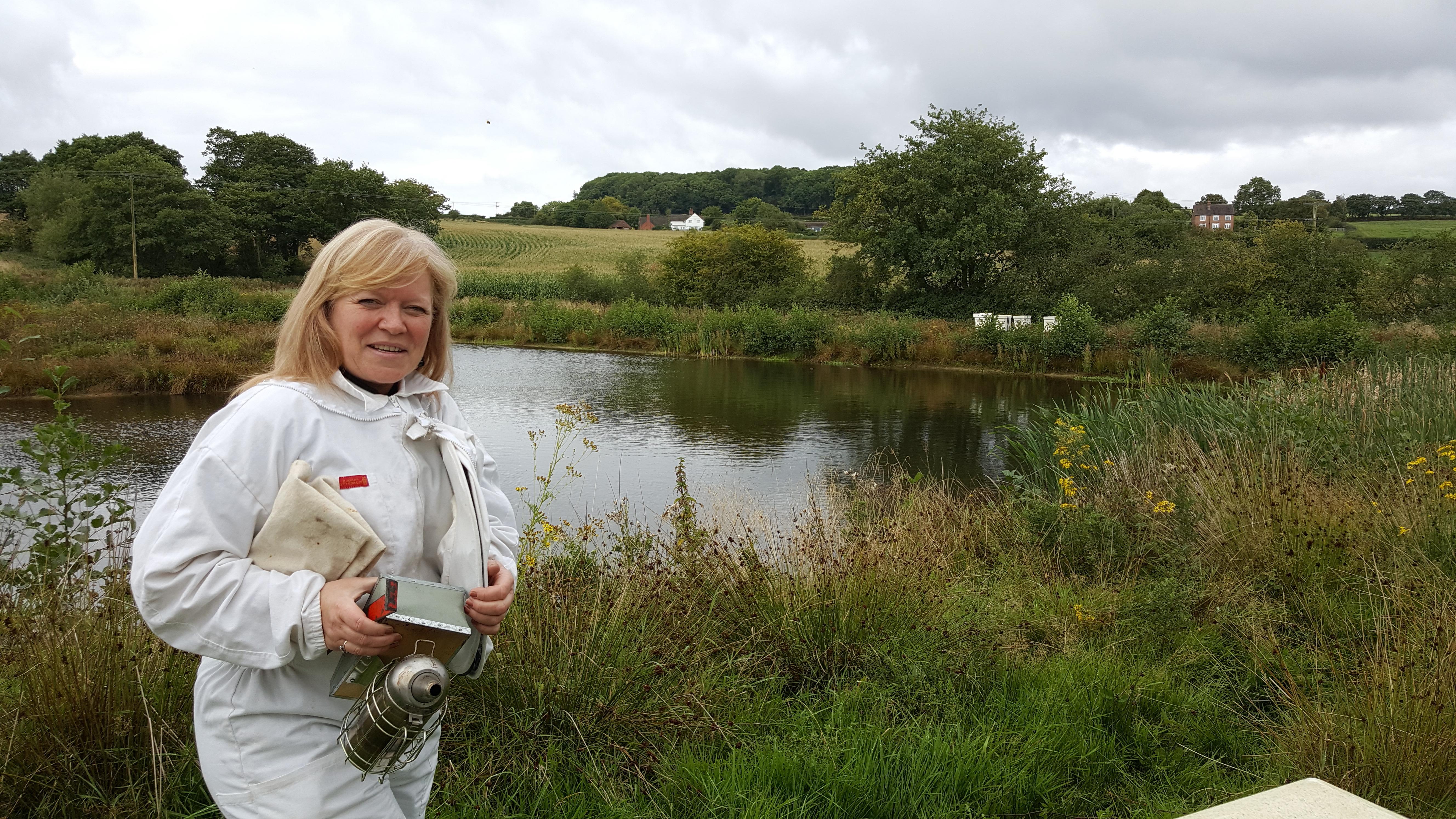 Deborah wearing a beekeeper suit