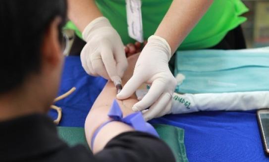 A lady giving blood