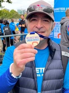 Kouros Majidi with his London Bridges Wellness Walk medal