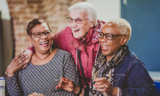 Three ladies laughing 