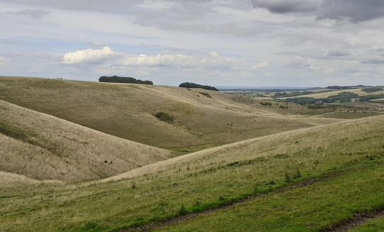 rolling hills cloudy sky 