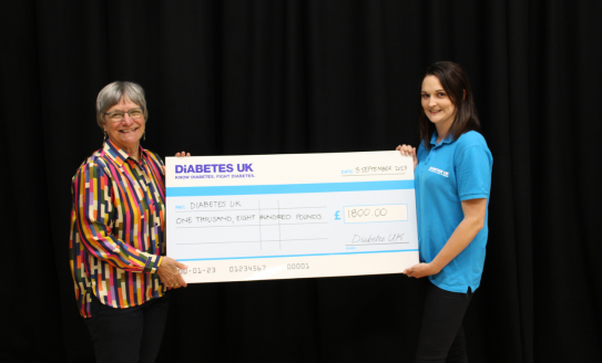 Cheque presentation with Diabetes UK representative and volunteer.